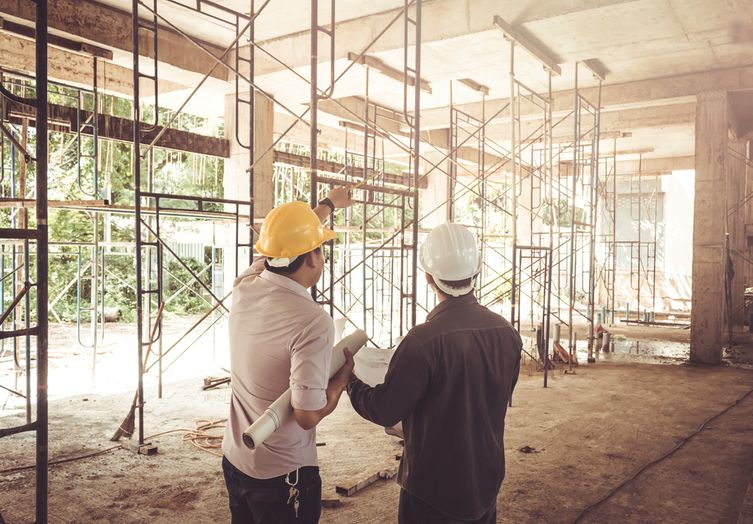 builders examining a structure 